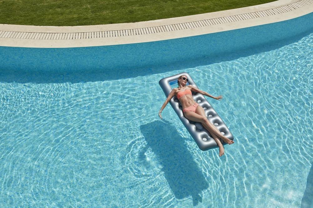 Elissa Adults-Only Lifestyle Beach Resort Kallithéa Dış mekan fotoğraf A woman on a pool float